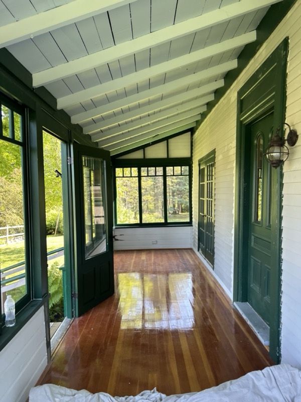 Sunporch with a freshly refinished, glossy wood floor