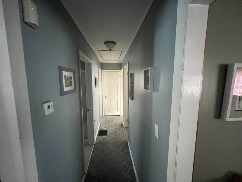Hallway with smooth, freshly painted blue-gray walls