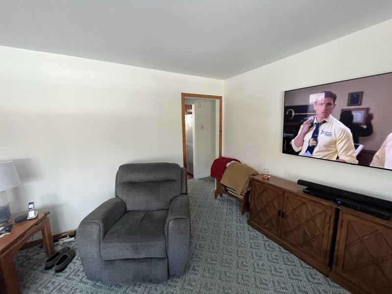 Living room with freshly painted white walls and ceiling