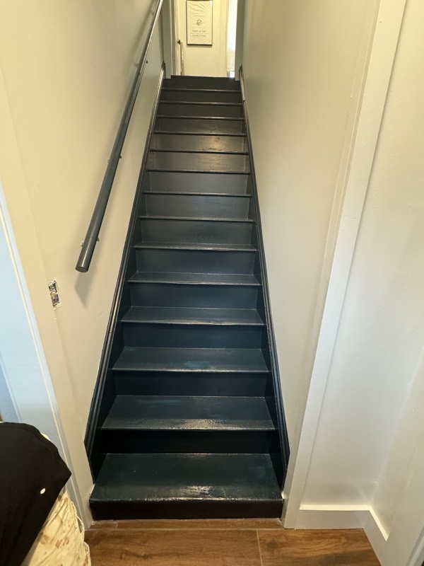 Staircase with freshly painted dark green treads